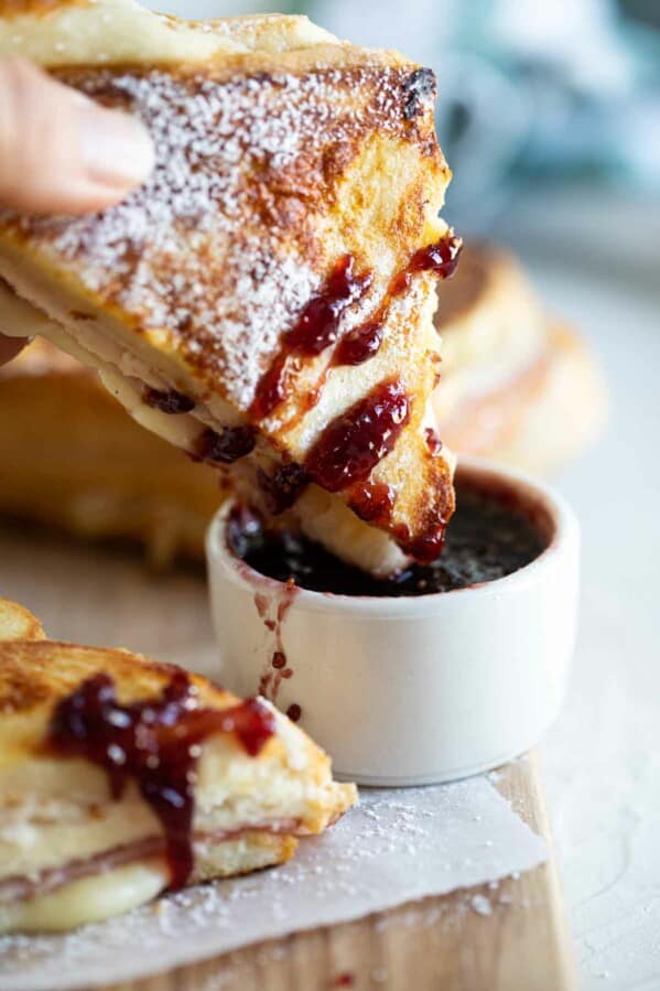 Dipping a Monte Cristo Sandwich into Jam