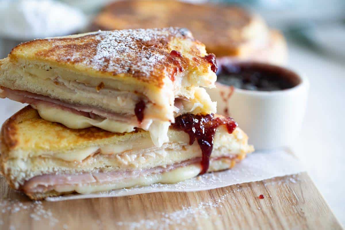 Monte Cristo Sandwich with Raspberry Jam with bite taken from it