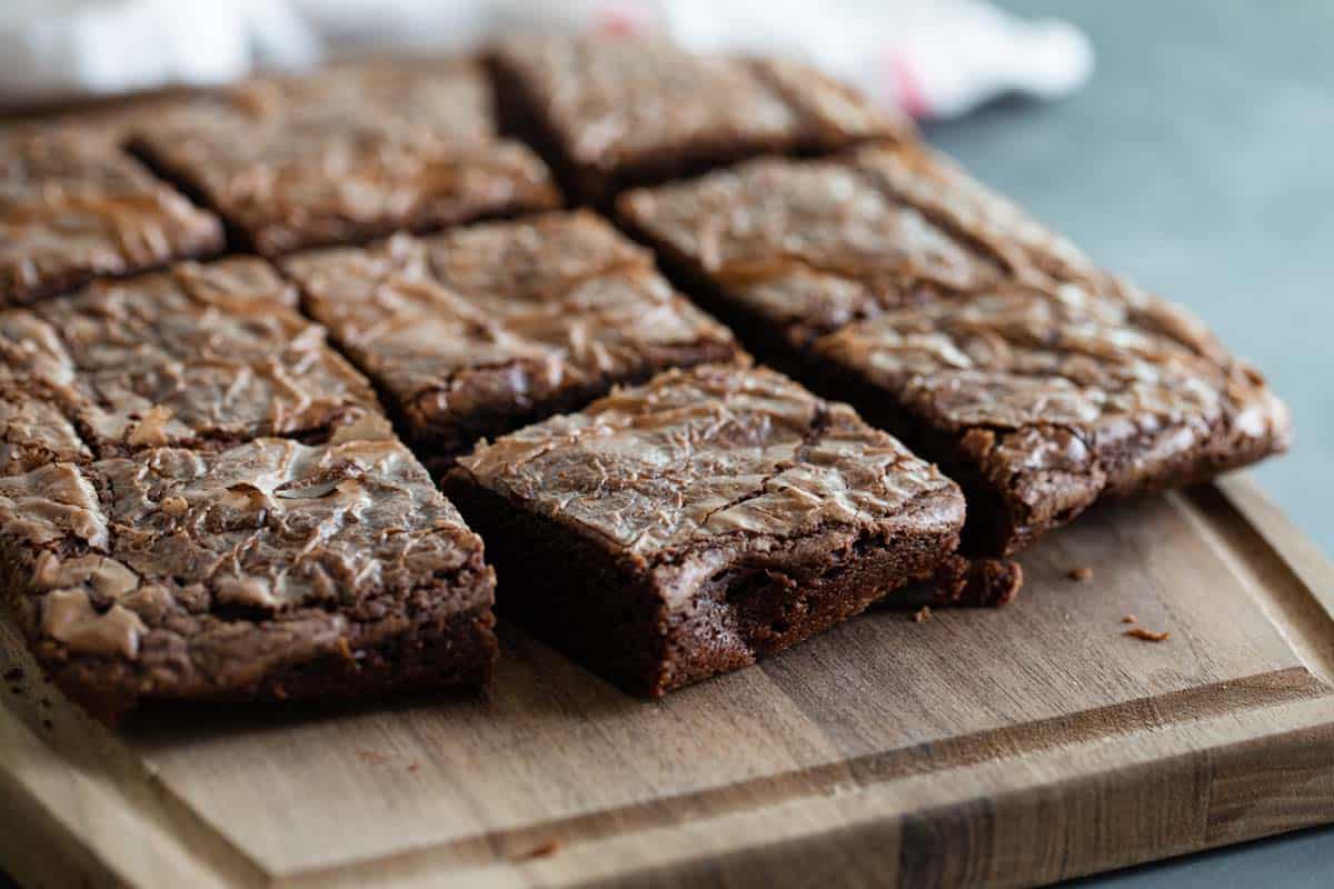 Sliced brownies on a cutting board.