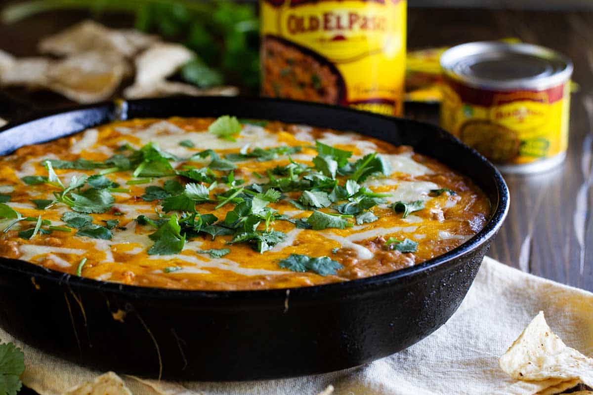 Hot Beef and Bean Dip in a cast iron skillet.