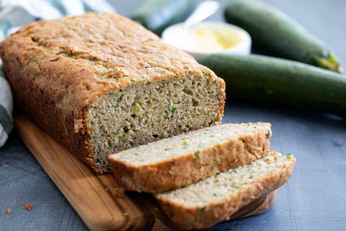 sliced zucchini bread on a cutting board