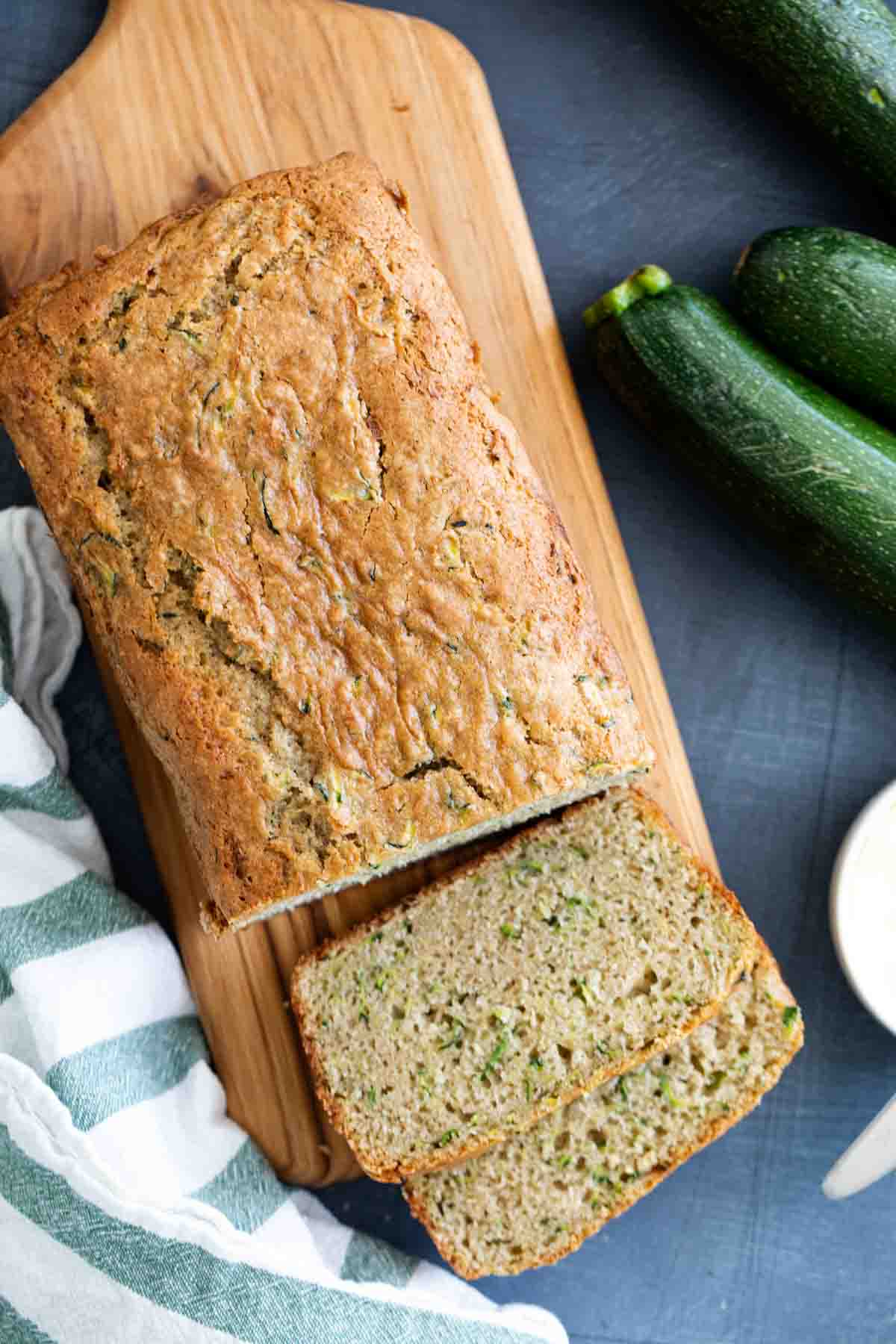 overhead view of zucchini bread with two slices cut