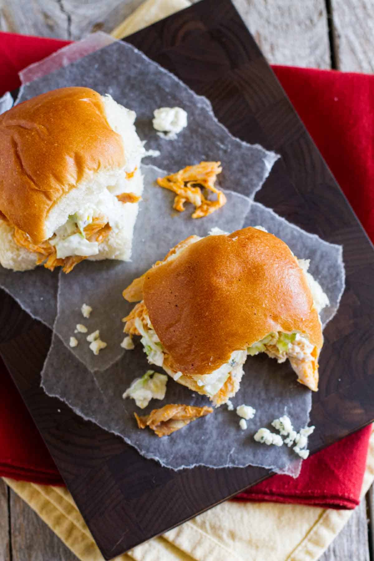 Buffalo Chicken Sandwiches with a bite taken from one.