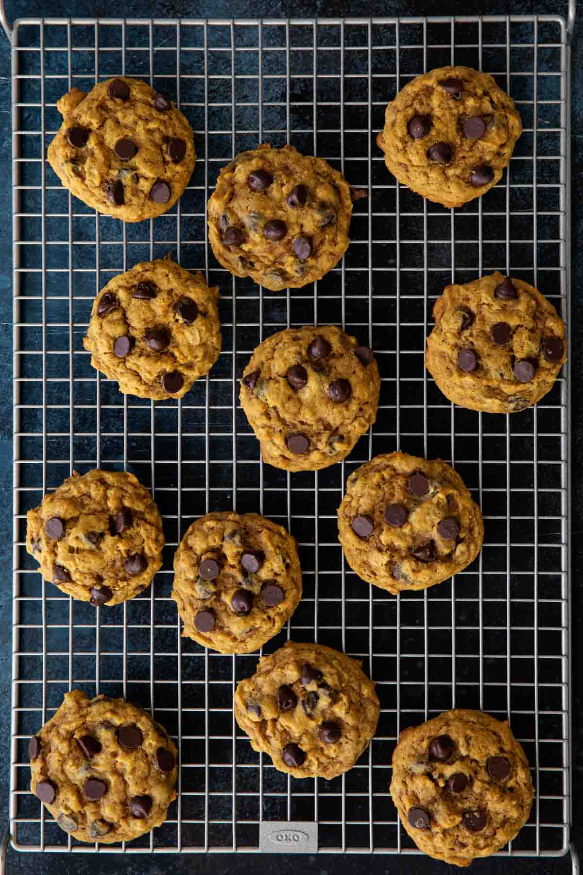 oatmeal cookies with pumpkin and chocolate chips cooling after baking.