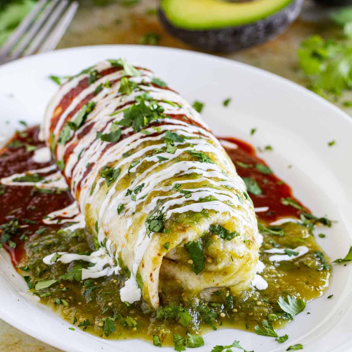 Burrito Recipe with Chicken smothered with red and green sauces.