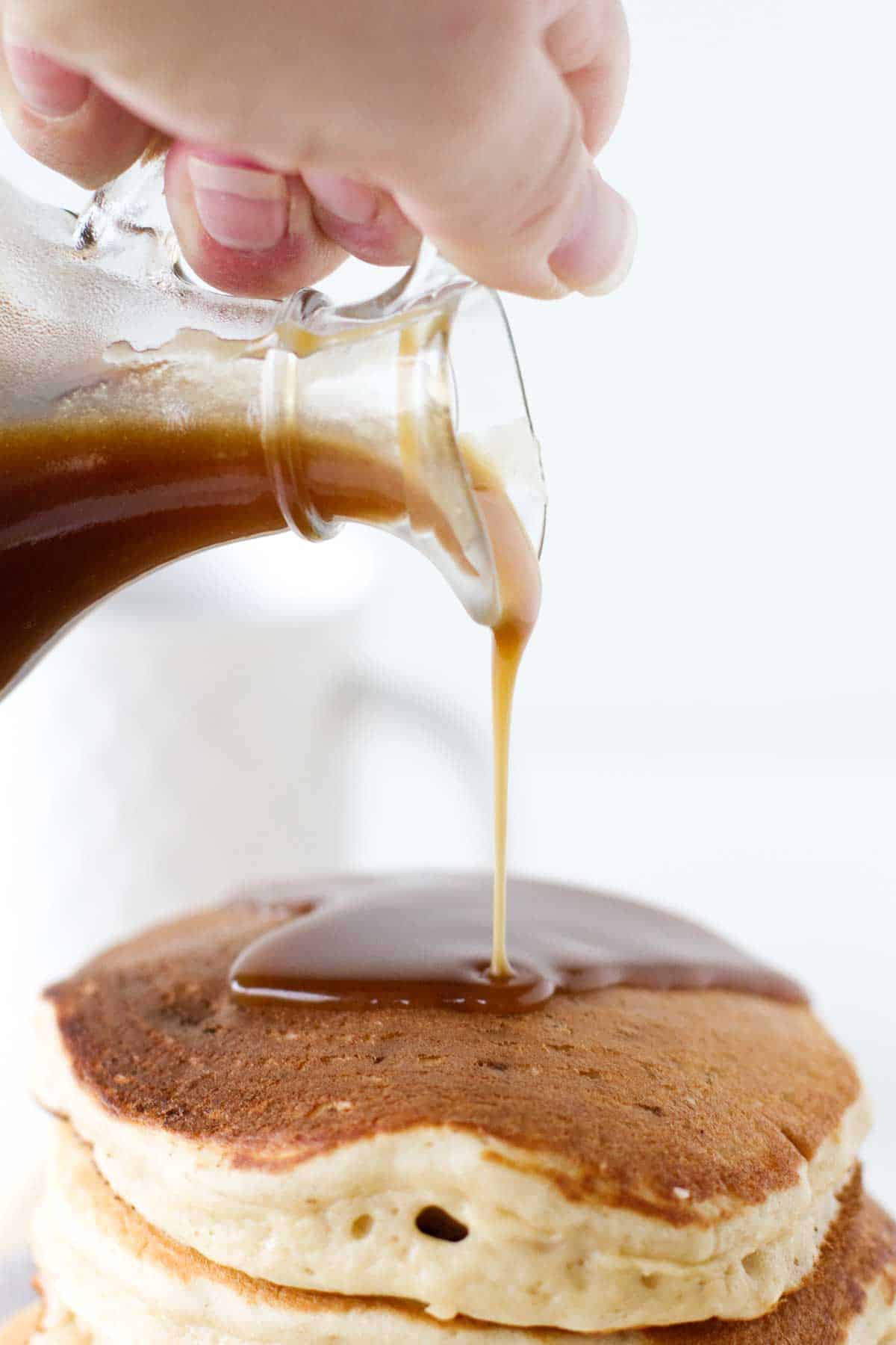 Caramel Apple Syrup being poured on pancakes