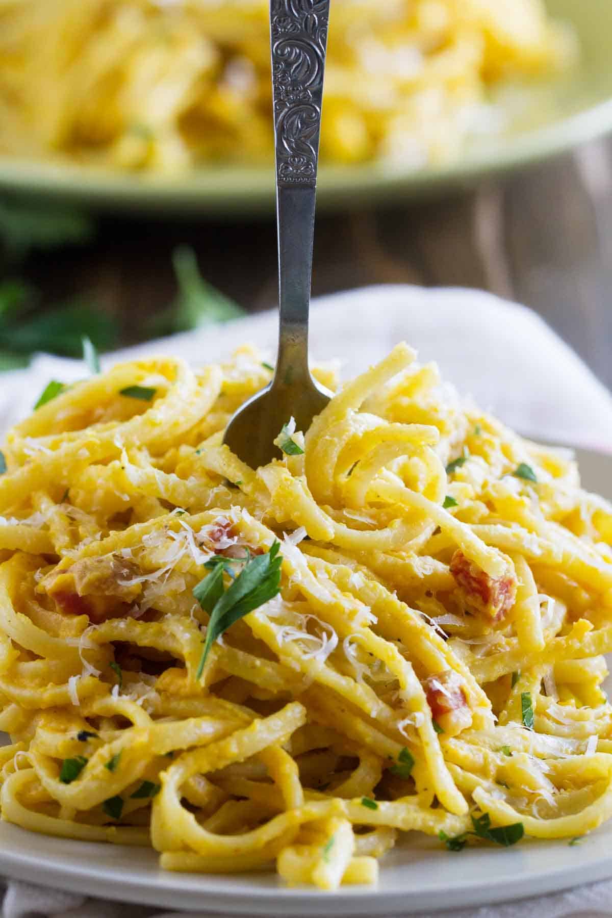fork in pasta with butternut squash sauce