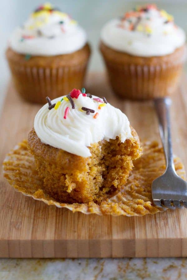 Look no further for the perfect pumpkin cupcake! These from scratch Pumpkin Cupcakes with Cream Cheese Frosting are moist and spiced and topped with the perfect cream cheese frosting. texture of pumpkin cupcakes