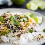 Slow cooker cilantro lime chicken with beans and corn over rice.