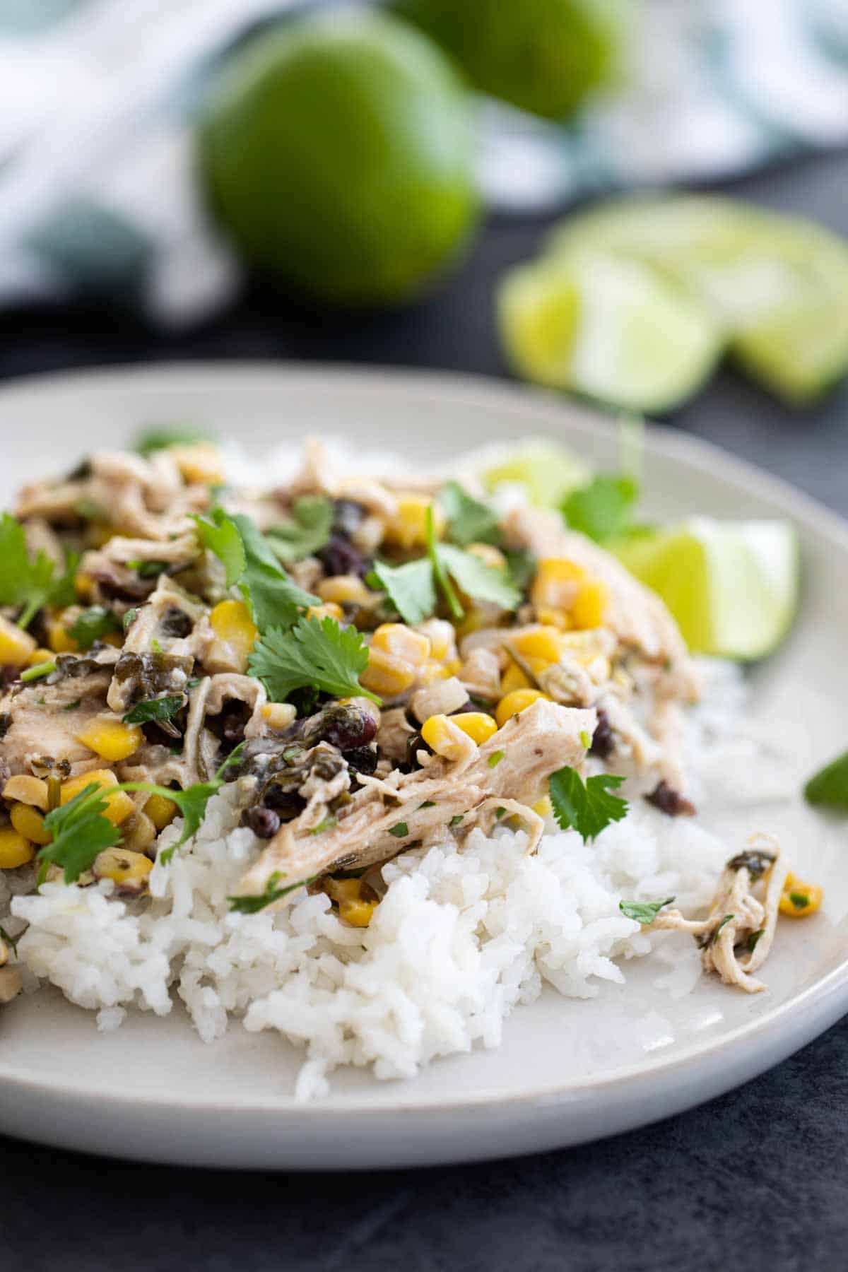 Slow cooker cilantro lime chicken with beans and corn over rice.