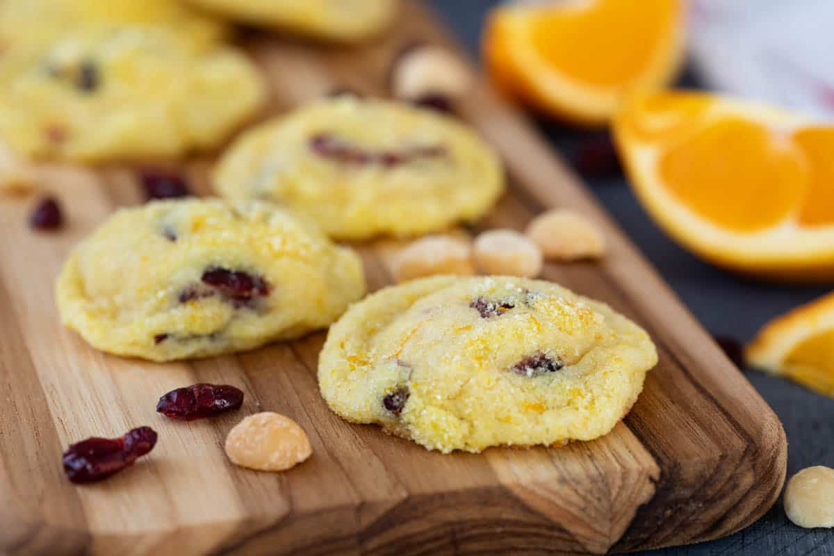 Coated in orange sugar and filled with crunchy macadamia nuts and chewy dried cranberries, these Cranberry Orange Cookies will become a holiday staple. They are also perfect for gifting! cookies with cranberries and orange