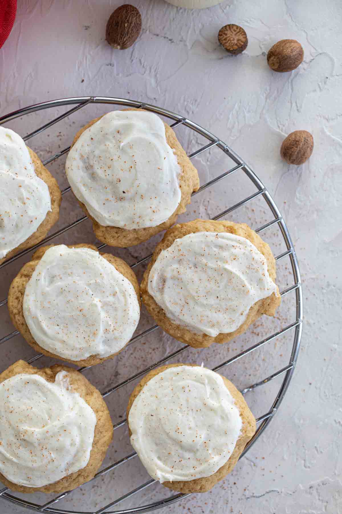 eggnog cookies with frosting and nutmeg