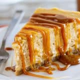 slice of pumpkin cheesecake topped with caramel sauce