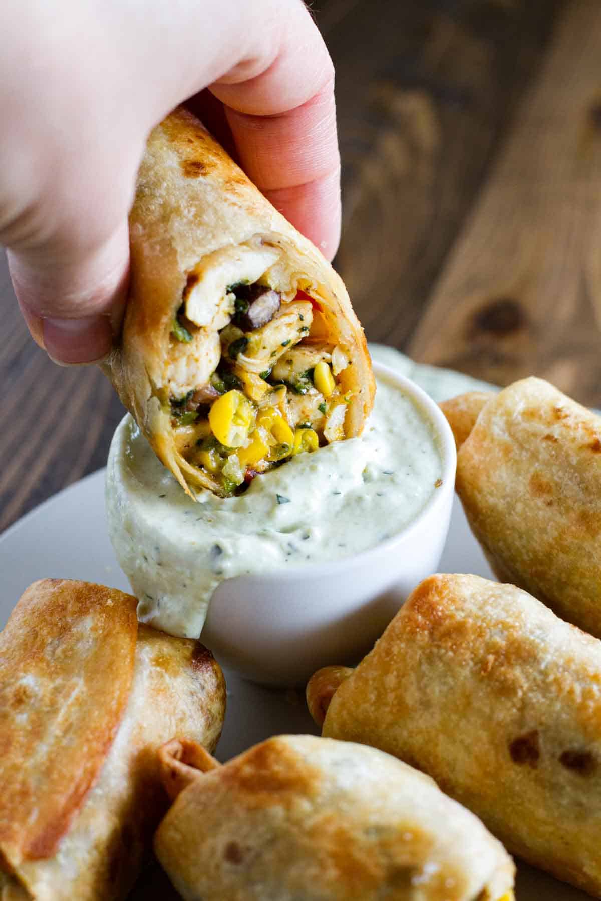 These Southwest Egg Rolls are a family favorite - filled with chicken, corn, beans, spinach and tex-mex spices. Serve with Avocado Ranch Dipping Sauce. Avocado Ranch Dipping Sauce