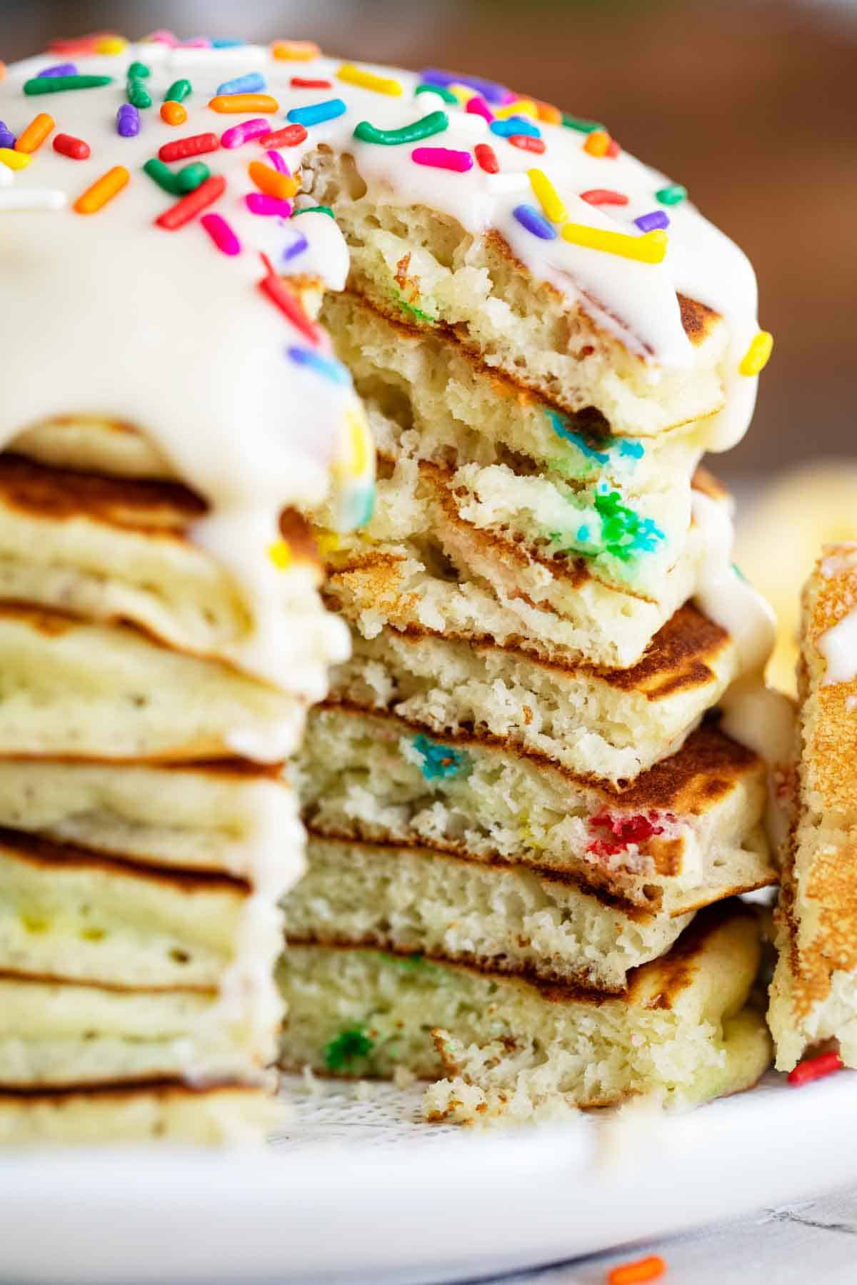 stack of funfetti pancakes with part taken out to show texture