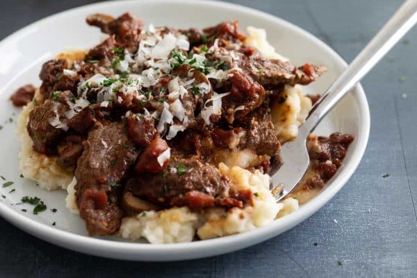 Ragu with Steak Served Over Mashed Potatoes