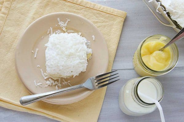 poke cake made with lemon curd and coconut