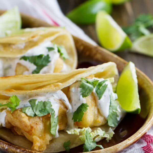 Plate with fish tacos with white sauce