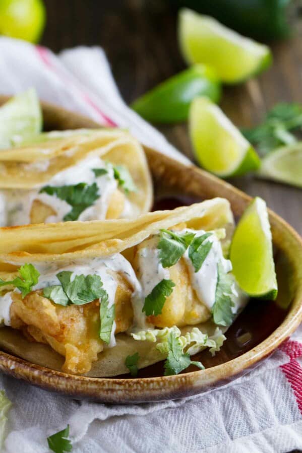 Plate with fish tacos with white sauce