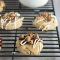 Toffee cookies topped with caramel icing and toffee