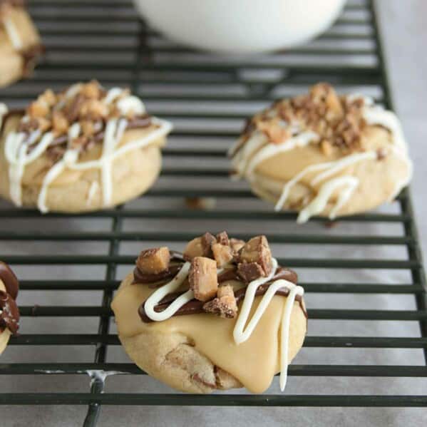 Toffee cookies topped with caramel icing and toffee