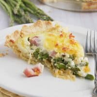 Slice of Ham Quiche with Asparagus.