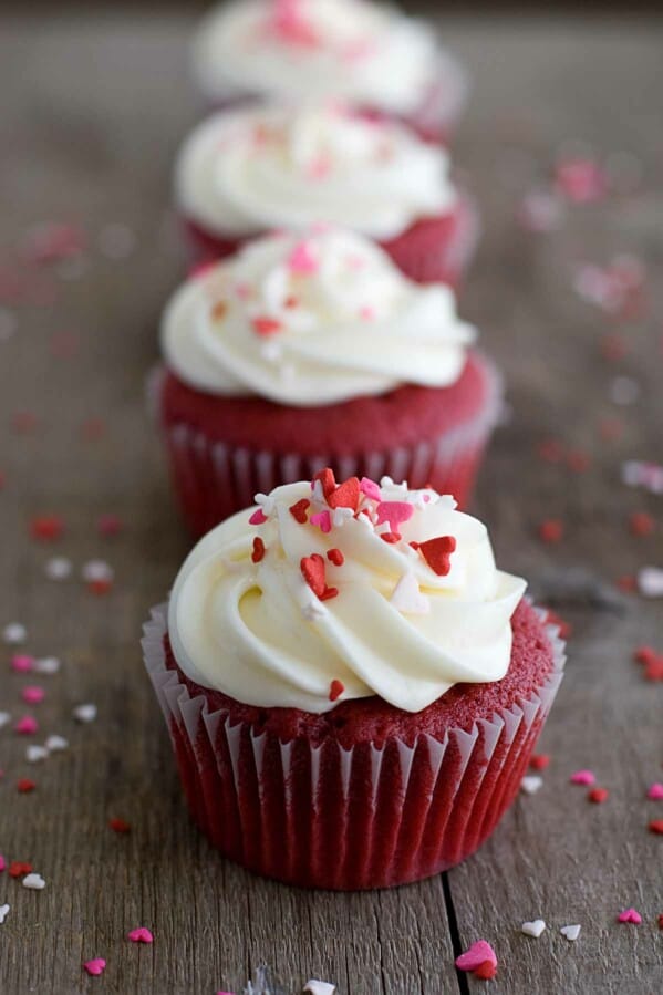 Red Velvet Cupcakes topped with frosting and sprinkles