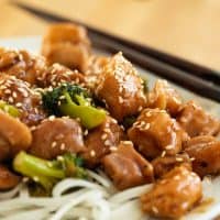 Sesame Chicken Stir Fry with Broccoli over Rice Noodles