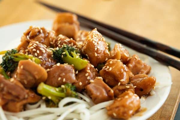 Stir Fry Sesame Chicken with Broccoli over Rice Noodles