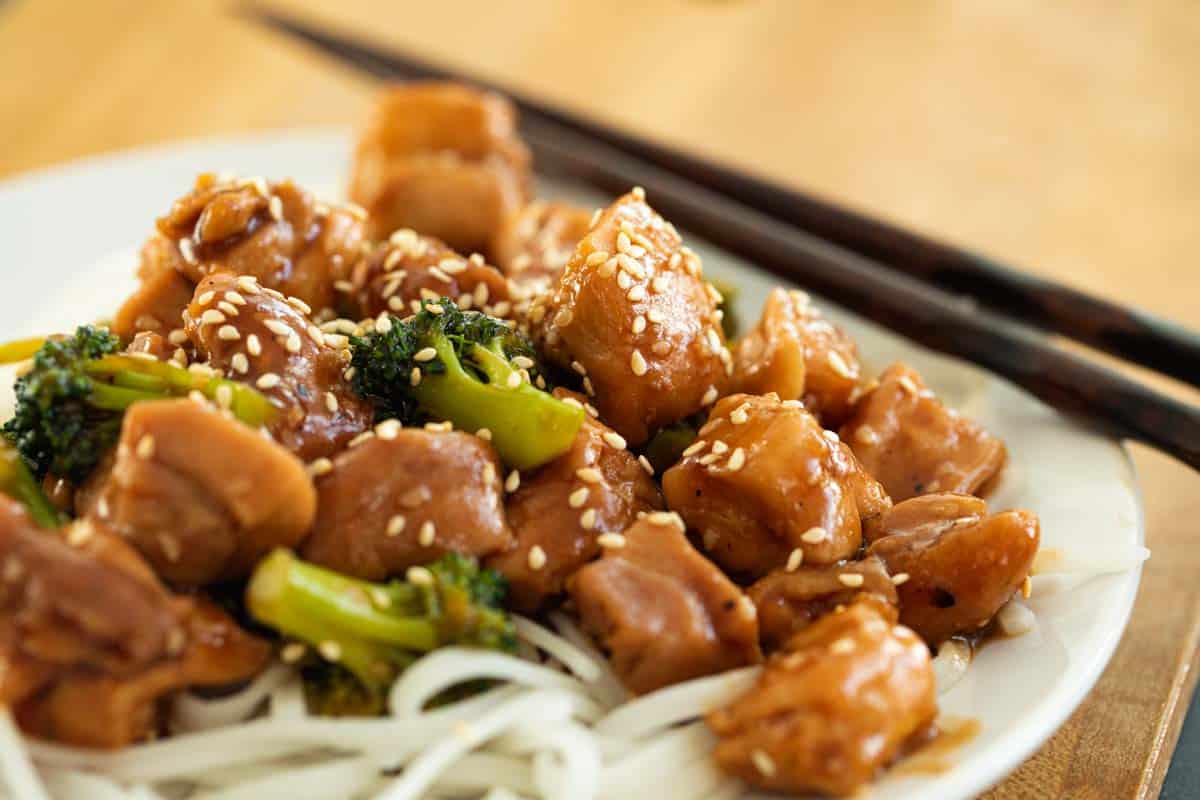 Sesame Chicken Stir Fry with Broccoli over Rice Noodles