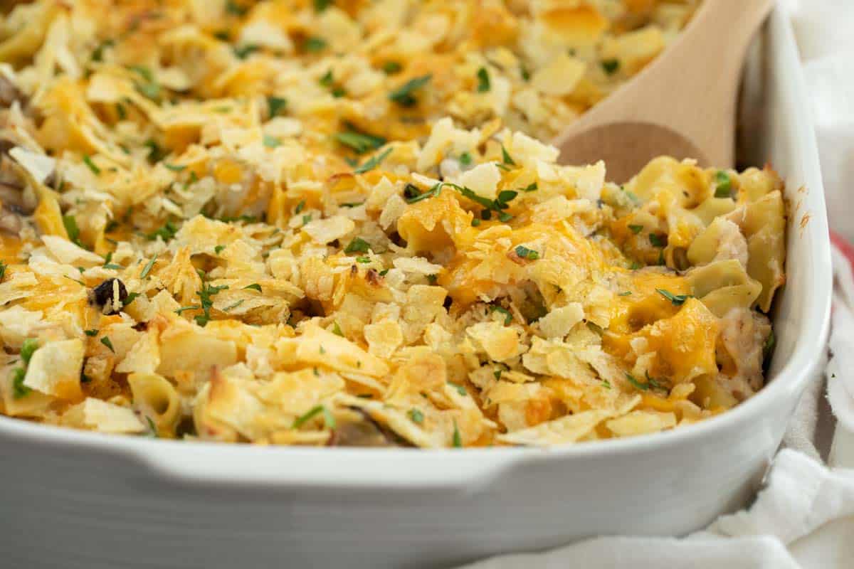 A childhood classic that should be in every recipe repertoire, this Tuna Casserole is nostalgic and comforting and creamy and delicious. It’s always a family favorite for a reason! Tuna Casserole Topped with Potato Chips