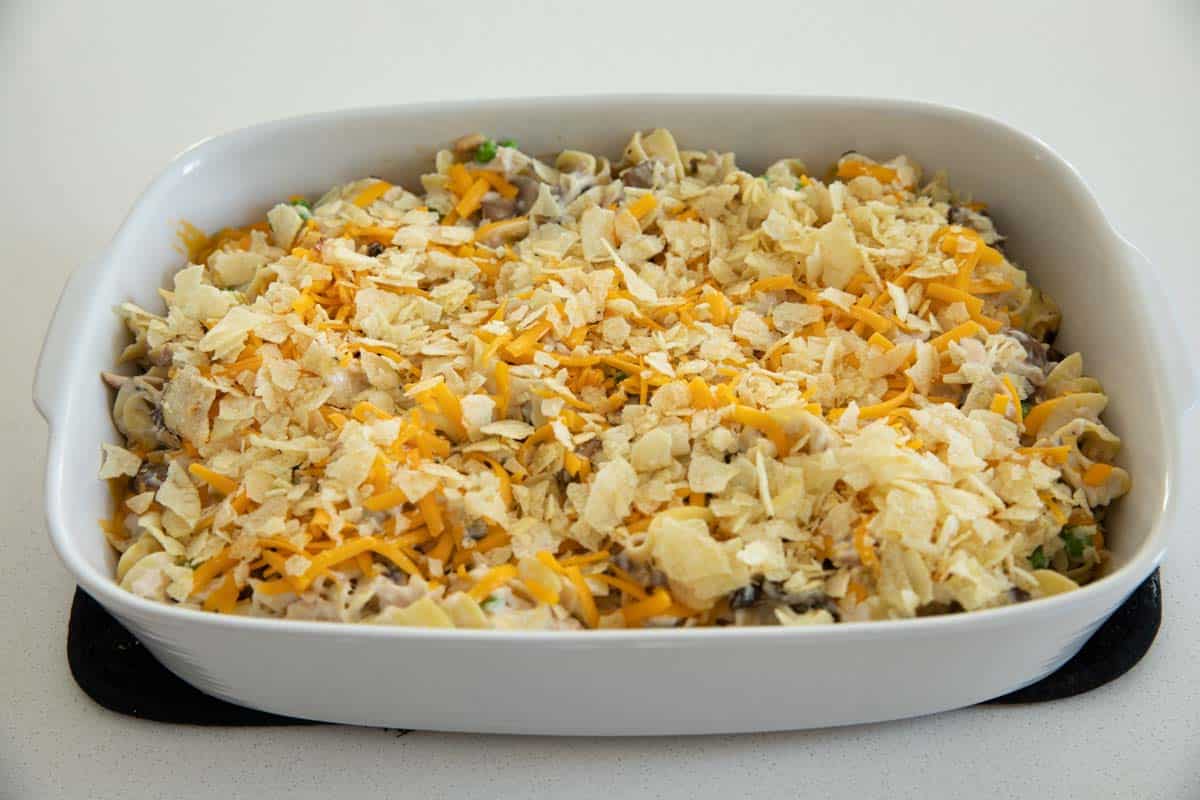 Topping a Tuna Casserole with Cheese and Potato Chips