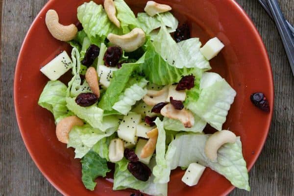 Salad with pears, apples, cashews and lemon poppy seed dressing
