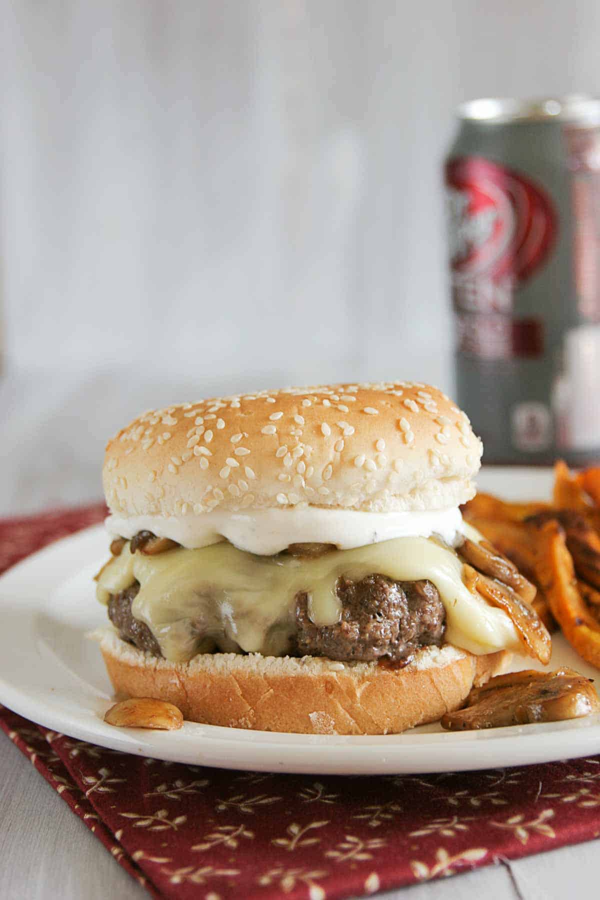 Worcestershire Burgers on a plate with sweet potato fries