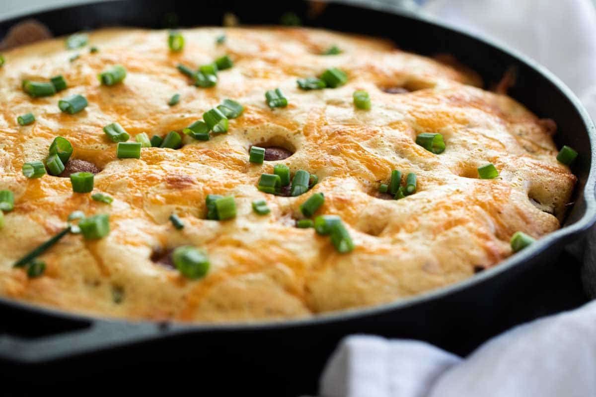 Corn Dog Casserole in a Cast Iron Skillet