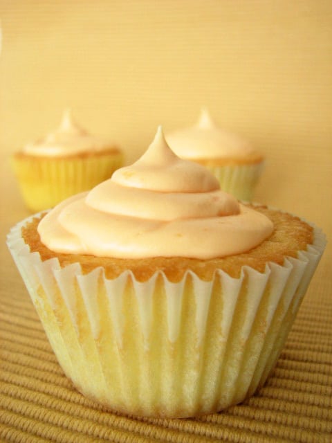 Vanilla Cupcake Topped with Orange Cream Cheese Frosting