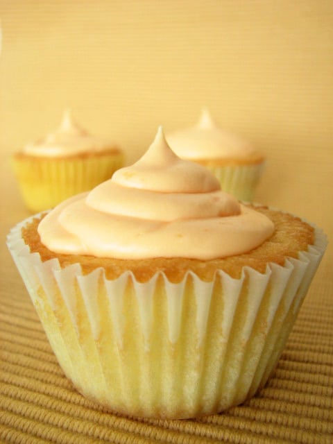 Vanilla Cupcake Topped with Orange Cream Cheese Frosting