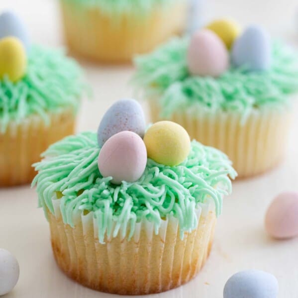 Easter Cupcakes Recipe topped with candy eggs.