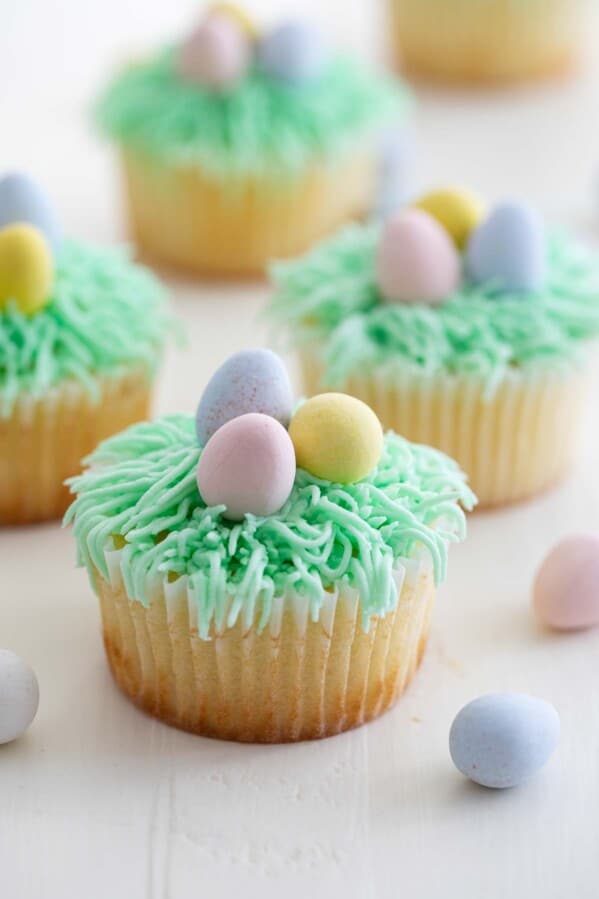 Easter Cupcakes Recipe topped with candy eggs.