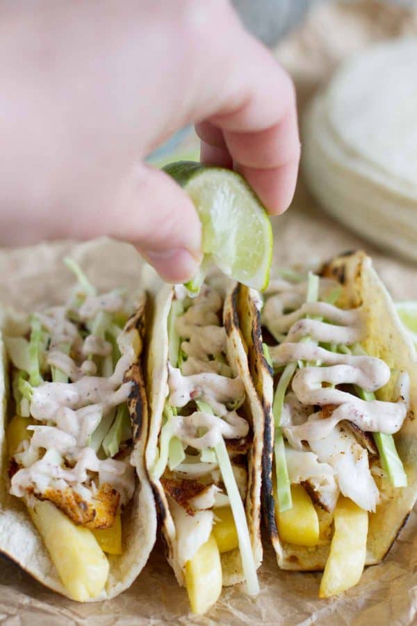 squeezing lime on tacos