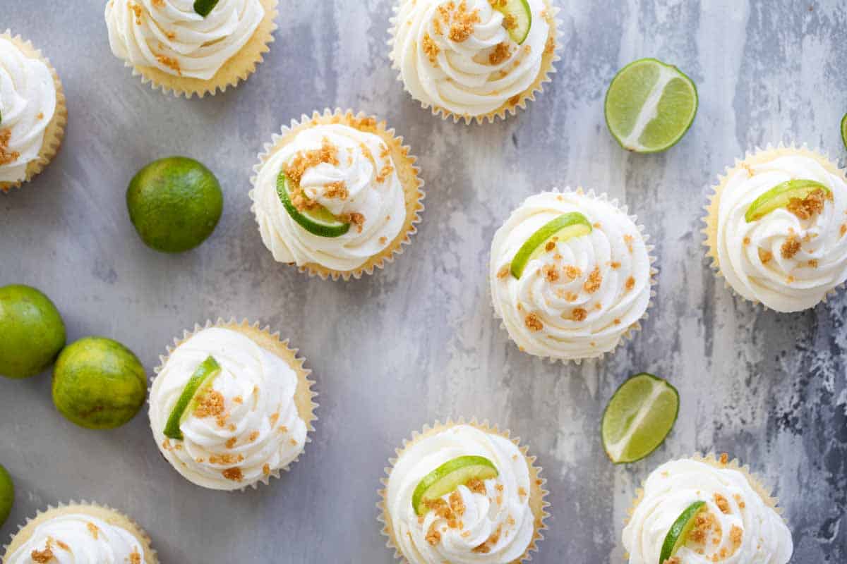 key lime cupcakes topped with graham cracker crumble