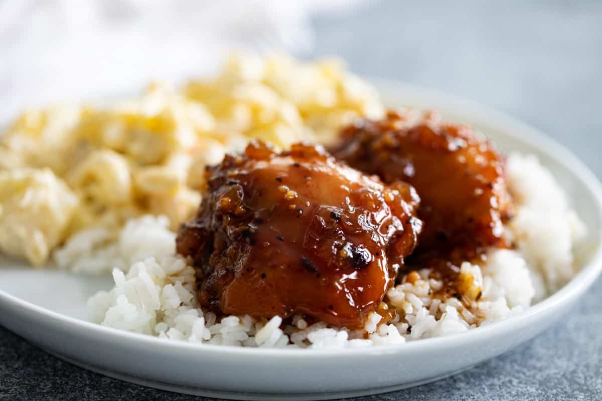 Shoyu Chicken over Rice on a plate.
