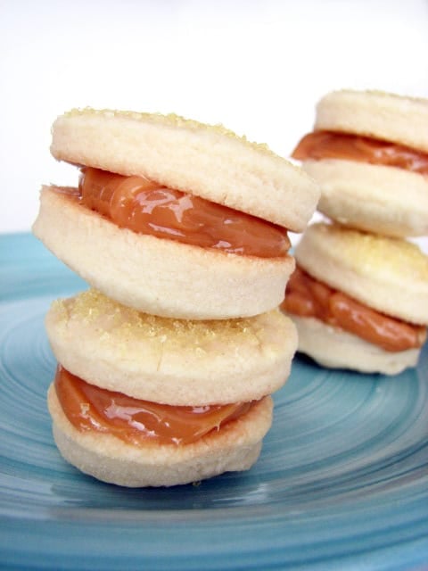 Alfajores de Dulce de Leche stacked on a plate