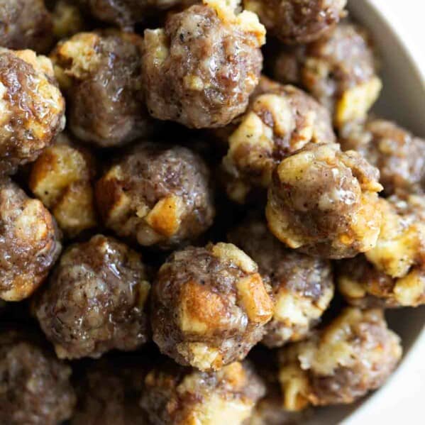 bowl of breakfast sausage meatballs with maple syrup