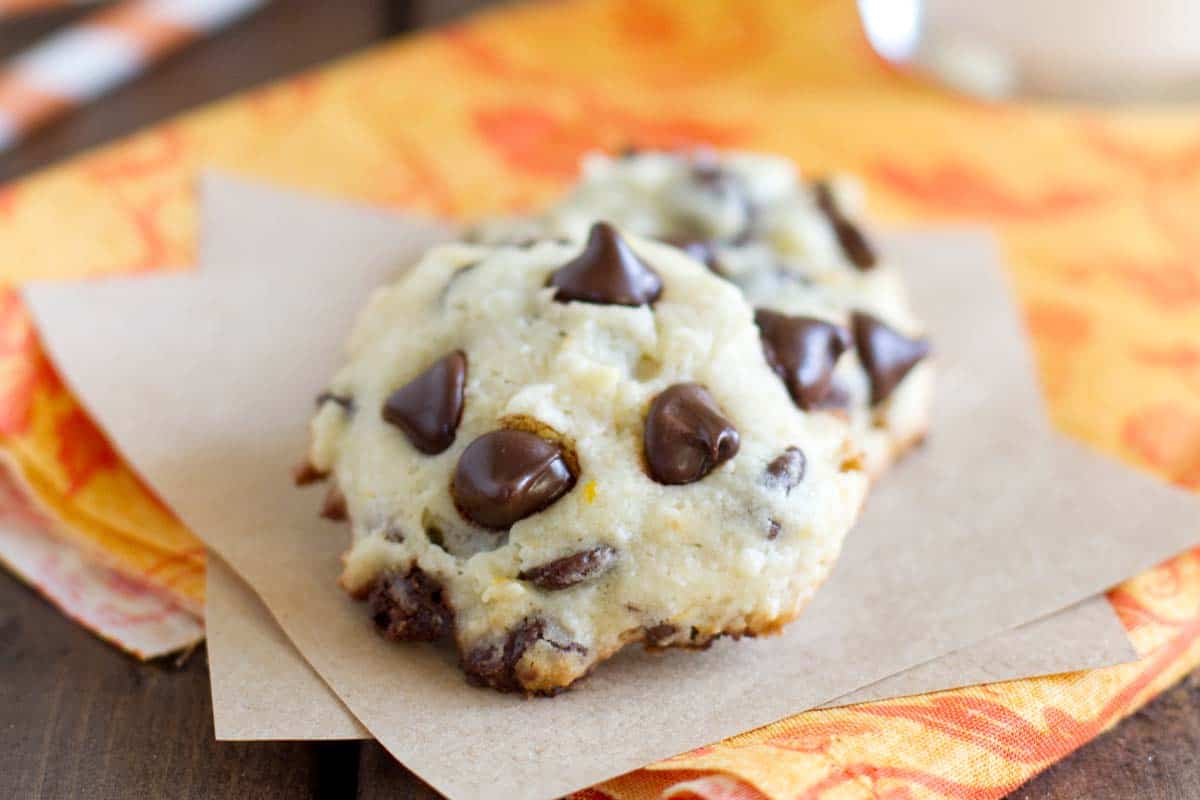 Orange Chocolate Chip Cookies on paper and orange fabric