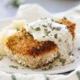 breaded pork chop with cream gravy on a plate