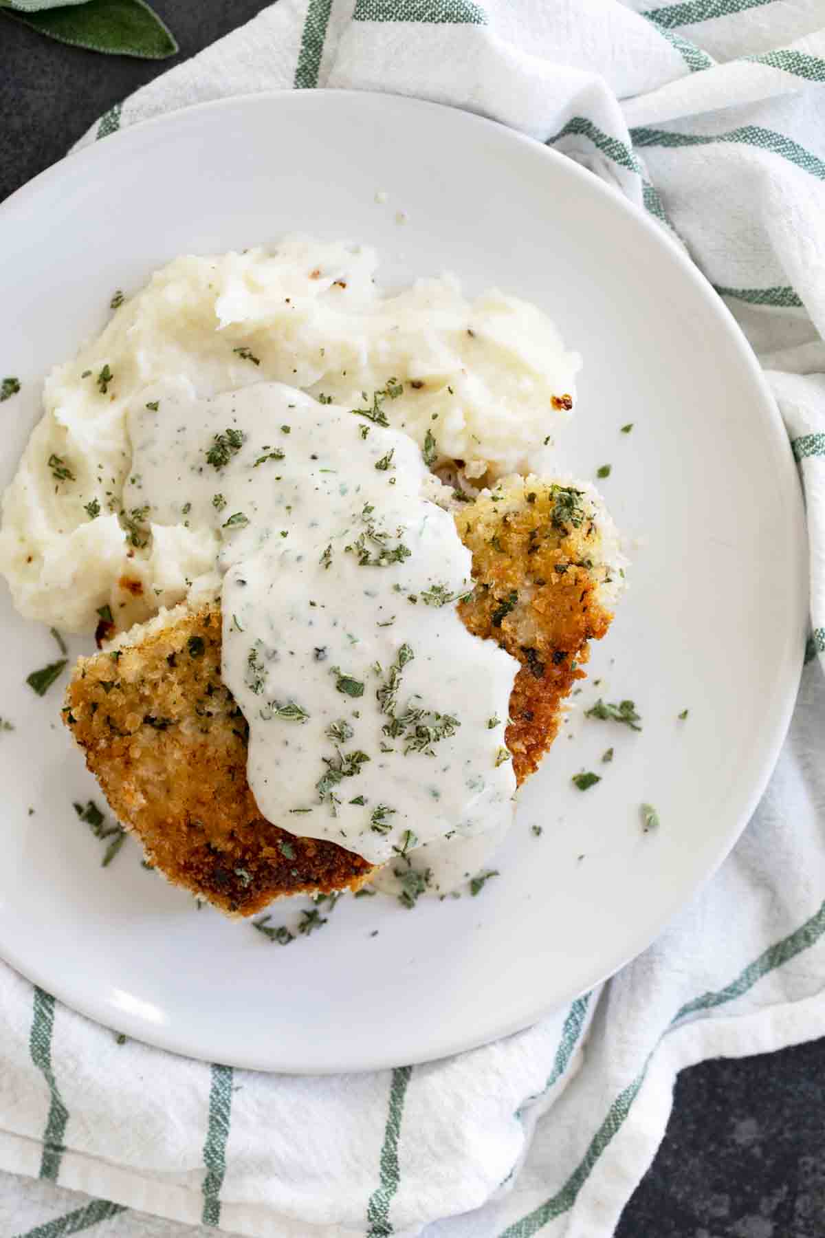 pork chops with gravy over mashed potatoes