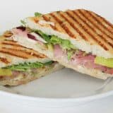 Grilled Eggplant, Prosciutto and Cheese Panini on a white plate