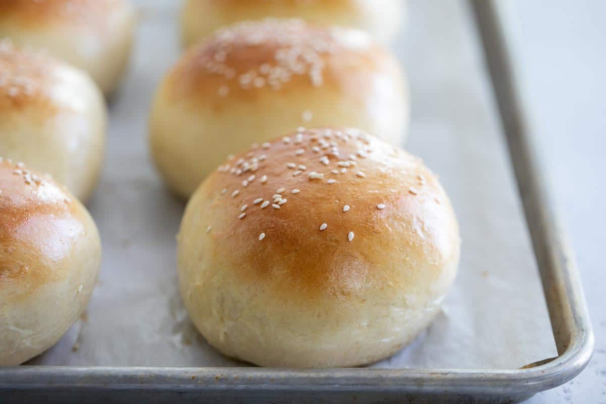 hamburger buns on a baking sheet