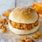 Hawaiian sloppy joes with filling falling out.